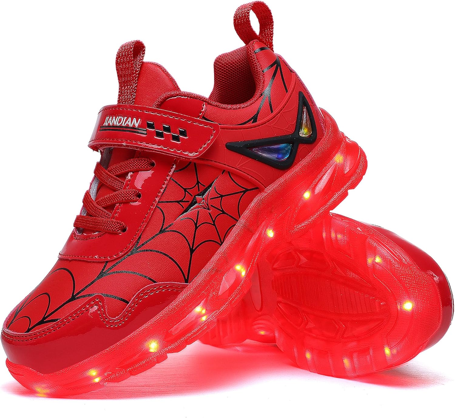 Spider-Man light-up shoes showing LED illumination and web design on a child's feet
