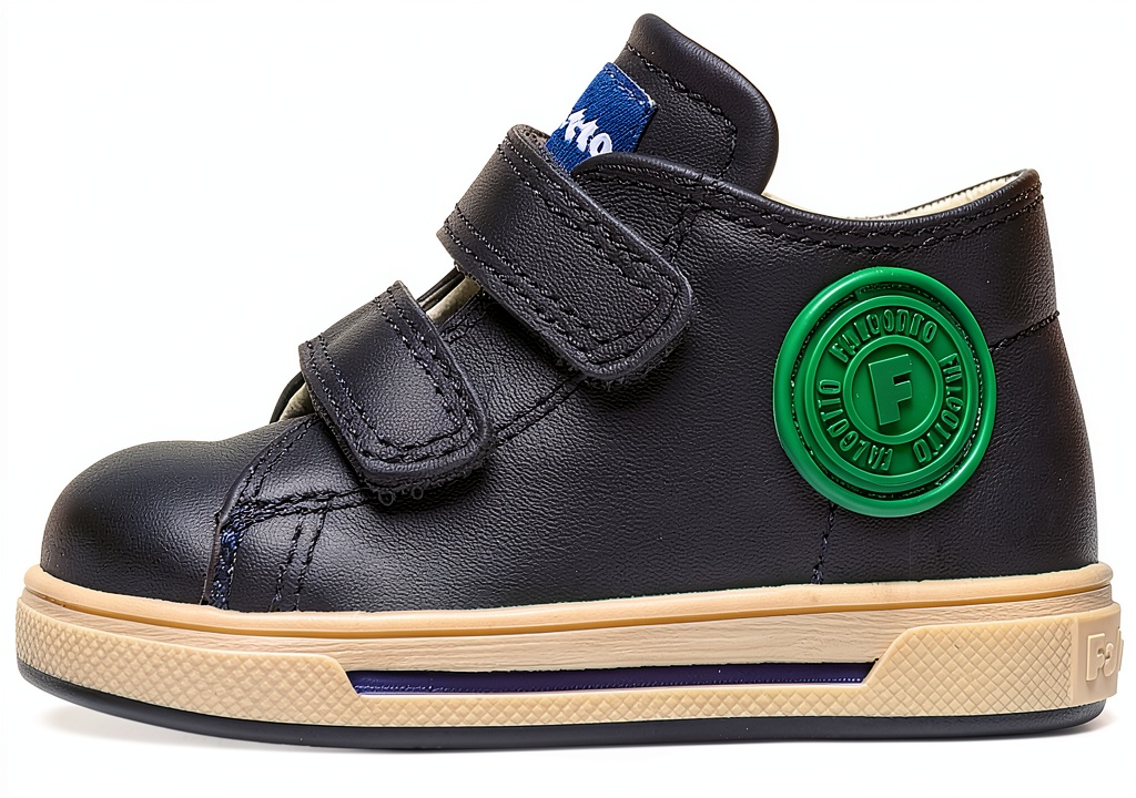 Installing Naturino Boys Walking Shoes Leather Lined on a wooden desk